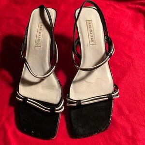 Black and white leather strap sandals with unique style heels. Size 10M